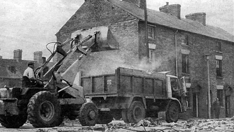 A bulldozer starts demolishion work in Cross Street in 1969